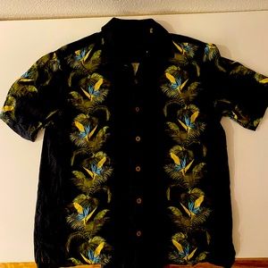 Tommy Bahama Hawaiian shirt 100% silk; size medium. Wooden buttons.